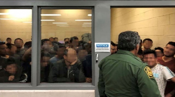 FILE PHOTO: Men are crowded in a room at a Border Patrol station in a still image from video in McAllen, Texas, U.S. on June 10, 2019 and released as part of a report by the Department of Homeland Security's Office of Inspector General on July 2, 2019. Picture pixelated at source. Office of Inspector General/DHS/Handout via REUTERS./File Photo
