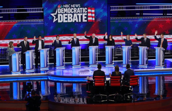 Democratic presidential candidates left  during the Democratic primary debate hosted by NBC News at the Adrienne Arsht Center for the Performing Arts, Thursday, June 27, 2019, in Miami. (AP Photo/Wilfredo Lee)