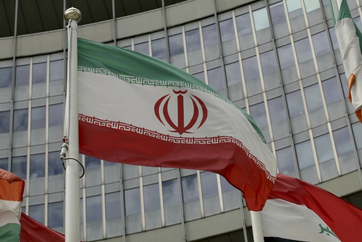 The Iranian flag waves outside of the UN building that hosts the International Atomic Energy Agency, IAEA, office inside in Vienna, Austria, Wednesday, July 10, 2019. (AP Photo/Ronald Zak)