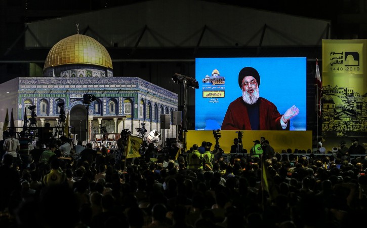 FILE - Hezbollah Supporters listen to Lebanon's Hezbollah leader Hassan Nasrallah delivers a speech via a big screen during a gathering to commemorate the 'Al-Quds (Jerusalem) International Day' in southern suburb of Beirut, Lebanon, 31 May 2019. EPA