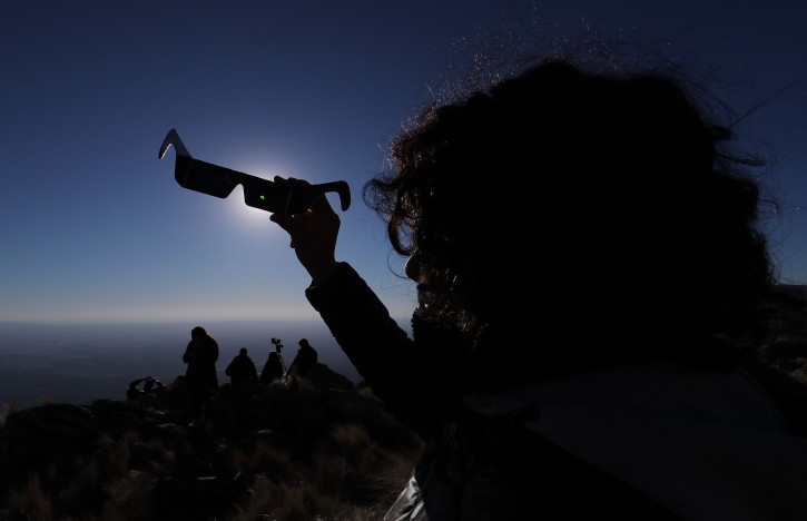 People observe the total solar eclipse, in Merlo, San Luis, Argentina, 02 July 2019. A total solar eclipse will cross above Chile and Argentina, as well as the waters of the South Pacific.  EPA
