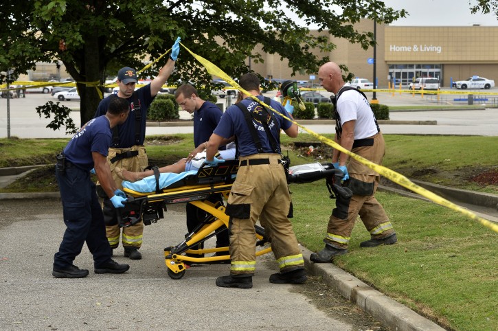 Paramedics offer medical attention after a shooting at a Walmart store Tuesday, July 30, 2019 in Southaven, Miss. (AP)